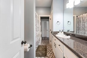 Combined shower/tub, hair dryer, towels, soap