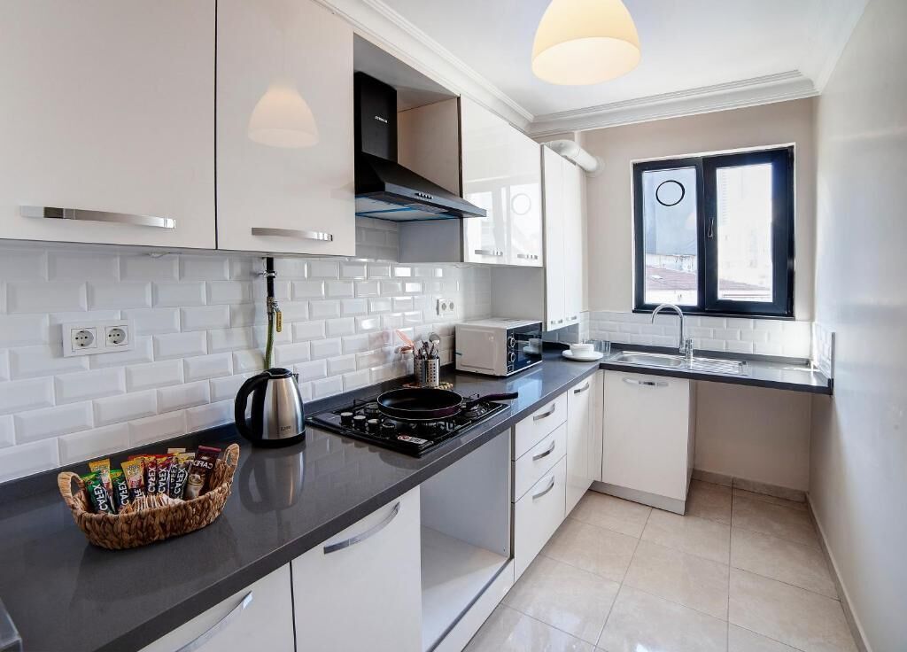 Family Condo, 2 Bedrooms | Private kitchen | Electric kettle, eco-friendly cleaning products