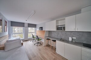 Desk, laptop workspace, free WiFi, bed sheets
