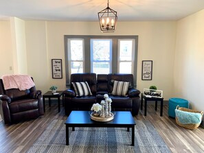 Classic House | Living area | 50-inch TV with cable channels - The Trotter Manor - With Private Yard & Parking, Near Falls & Casino by Niagara Hospital (Niagara Falls)