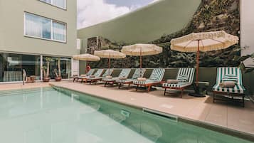 Indoor pool, outdoor pool, open 10:00 AM to 8:00 PM, pool umbrellas
