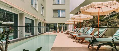 Indoor pool, outdoor pool, open 10:00 AM to 8:00 PM, pool umbrellas