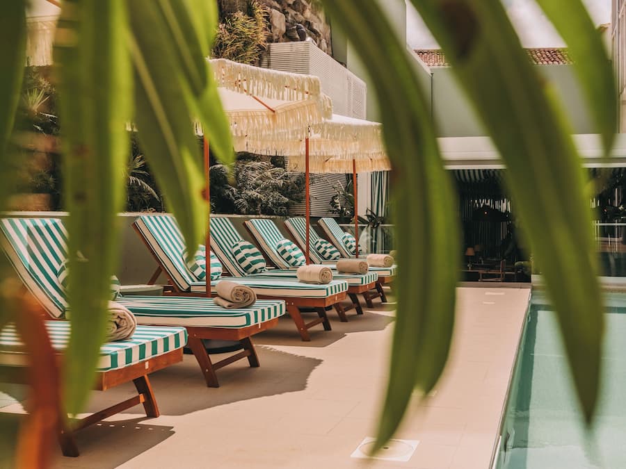 Indoor pool, outdoor pool, open 10:00 AM to 8:00 PM, pool umbrellas