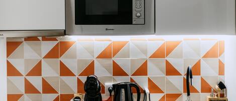Fridge, microwave, stovetop, coffee/tea maker