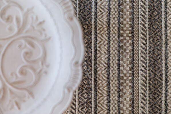 A close-up of a patterned fabric with a woven design.