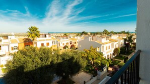 A coastal town with white buildings, a clear blue sky, and a view of the sea. - Beautiful sunny top floor apartment in Ciudad Quesada, Rojales (Ciudad Quesada)