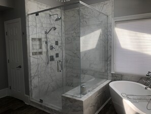 Bathtub, hair dryer, towels, soap