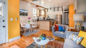 A modern apartment with a kitchen, dining area, and living room. - New distinctive historical  unit from 5 Star Host (Salt Lake City)