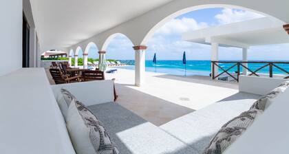 Brand New 12 Suite Villa directly on the waters edge of the Caribbean Sea