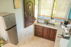 Fridge, microwave, stovetop, coffee/tea maker