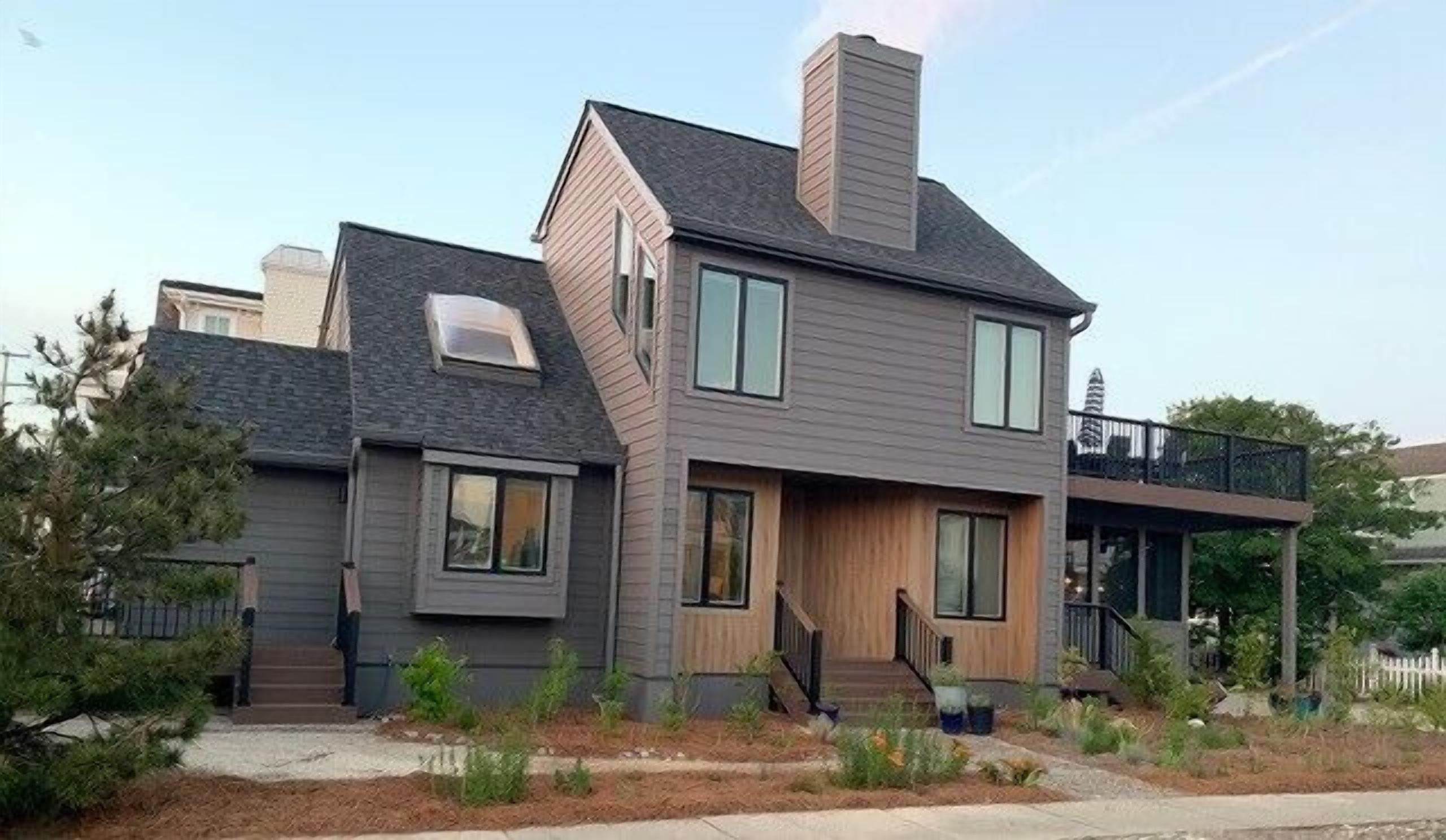 Comfortable 4 bedroom, 3 bath home nestled behind established landscaping in Avalon s popular south end.