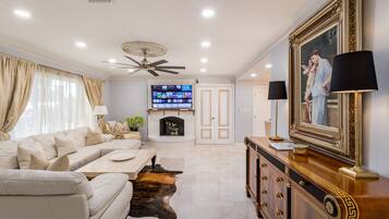 Smart TV, fireplace, books, stereo