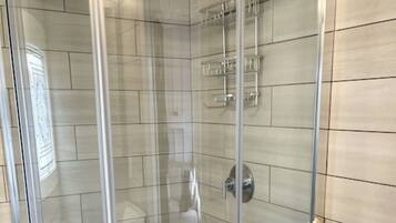 Shower, towels, soap, toilet paper