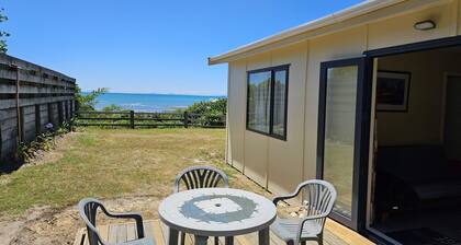 Nestled in the heart of Tasman, this lovely cabin is located at the scenic Kina Peninsula
