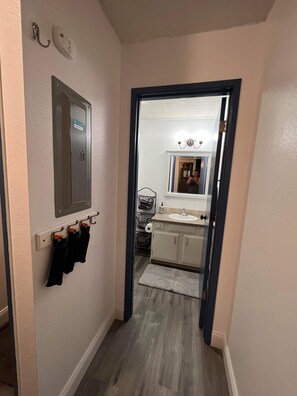 Combined shower/bathtub, hair dryer, towels, toilet paper