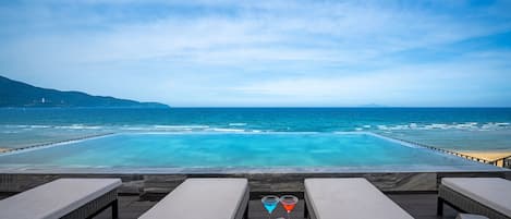 Outdoor pool, pool umbrellas, sun loungers