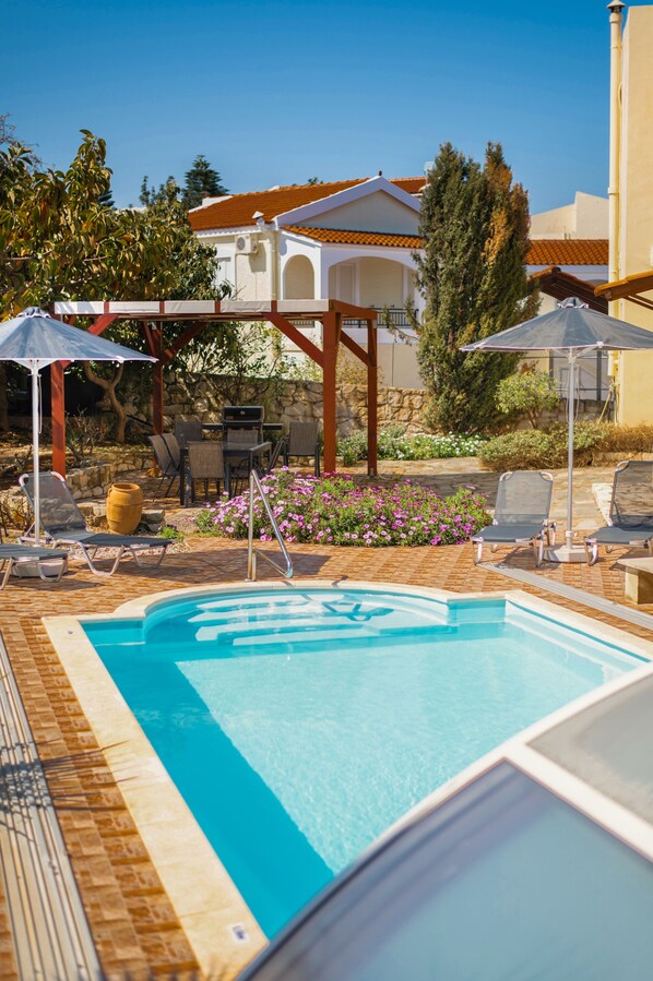 Outdoor pool, pool umbrellas, pool loungers