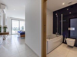 Bathtub, hair dryer, towels