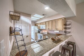 Condo, 2 Bedrooms | Private kitchen | Fridge, oven, coffee/tea maker, toaster - The Iron Cactus on the Comal CW C102 2 Bedroom Condo by RedAwning (New Braunfels)
