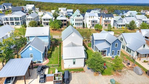 A residential area with houses featuring gabled roofs and a mix of architectural styles.