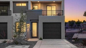 A modern multi-story residential building with a flat roof, balconies, and a garage. - V 31| 3-Level Townhome *Pool* Hot Tub * Pickleball (St. George)