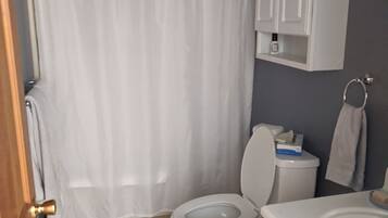 Hair dryer, towels, soap, toilet paper