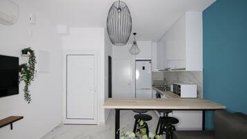 Apartemen Junior | Area keluarga | TV layar datar