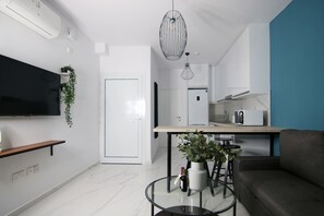 Junior Apartment | Living area | Flat-screen TV - Limnaria 123: Seaside Romantic Flat (Paphos)