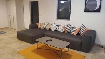 VIP Apartment | Living area | 109-cm LCD TV with digital channels, TV