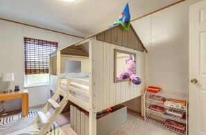 A child's bunk bed with a slide, a desk, and a bookshelf in a room with a window and a door. - Private Pet Friendly Home Near Exotic Deer Farm, Pigeon Forge and Gatlinburg TN  (Sevierville)