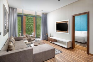 Suite, 1 habitación | Zona de estar | Una televisión de pantalla plana