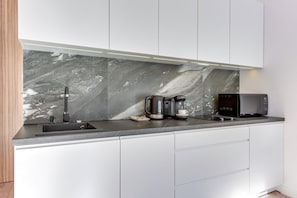 Fridge, microwave, stovetop, coffee/tea maker
