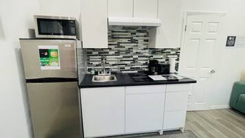 Fridge, microwave, stovetop, coffee/tea maker