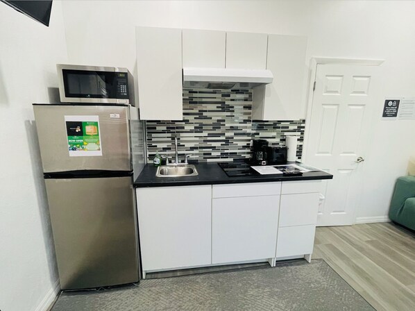 Fridge, microwave, stovetop, coffee/tea maker