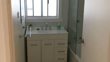 Combined shower/bathtub, soap, toilet paper