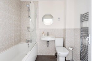 Bathtub, hair dryer, towels