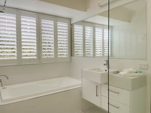 Bathtub, hair dryer, towels, soap