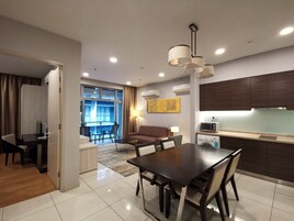 1 Bedroom Executive | Living area | 50-inch LED TV with cable channels, TV