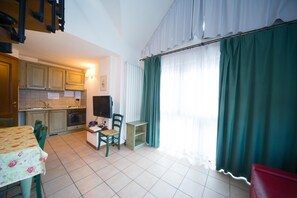 Fridge, microwave, stovetop, dining tables