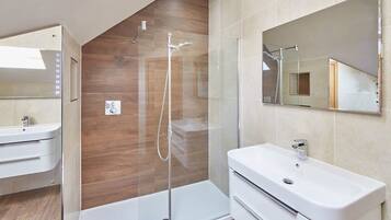 Bathtub, hair dryer, towels, soap