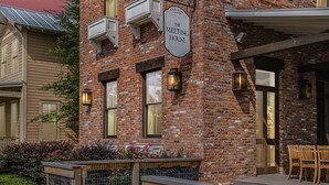 A brick building with a sign reading "The Meeting House."