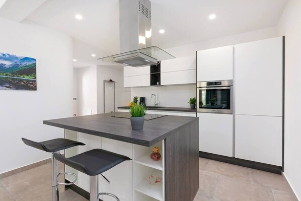 Villa | Private kitchen | Fridge, microwave, oven, stovetop