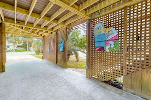 Relax under a wooden ceiling with a view of the surrounding landscape.
