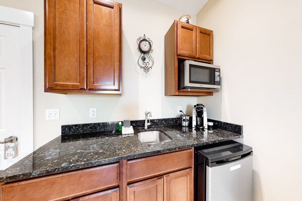 Mini-fridge, microwave, coffee/tea maker, cookware/dishes/utensils