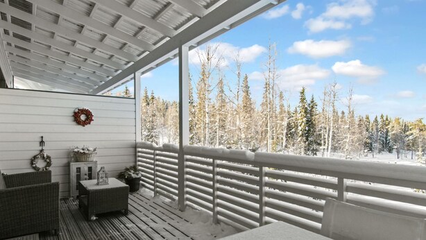 A covered porch with a view of a snowy forest. - Skivillas 78 ukkohalla (2) by Interhome (Hyrynsalmi)