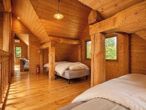 A wooden cabin interior with a loft bed, a second bed, and a staircase leading to an upper level. - Rental Villa No 818 LDK 18 tatami mats  Western / Yama-gun Fukushima (Yama-gun)