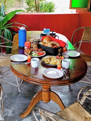 A table set with various dishes, condiments, and utensils, suggesting a meal setting.
