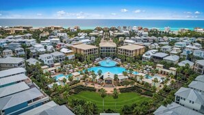 A resort with multiple buildings, a central pool, and a view of the ocean. - 248 Beach Bike Way (Inlet Beach)