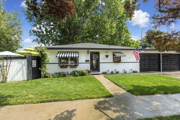 A single-story house with a front porch, a garage, and a well-maintained lawn. - ENJOY THE HISTORY, NOSTALGIA AND CULTURE OF OLD TOWN MERIDIAN (Meridian)