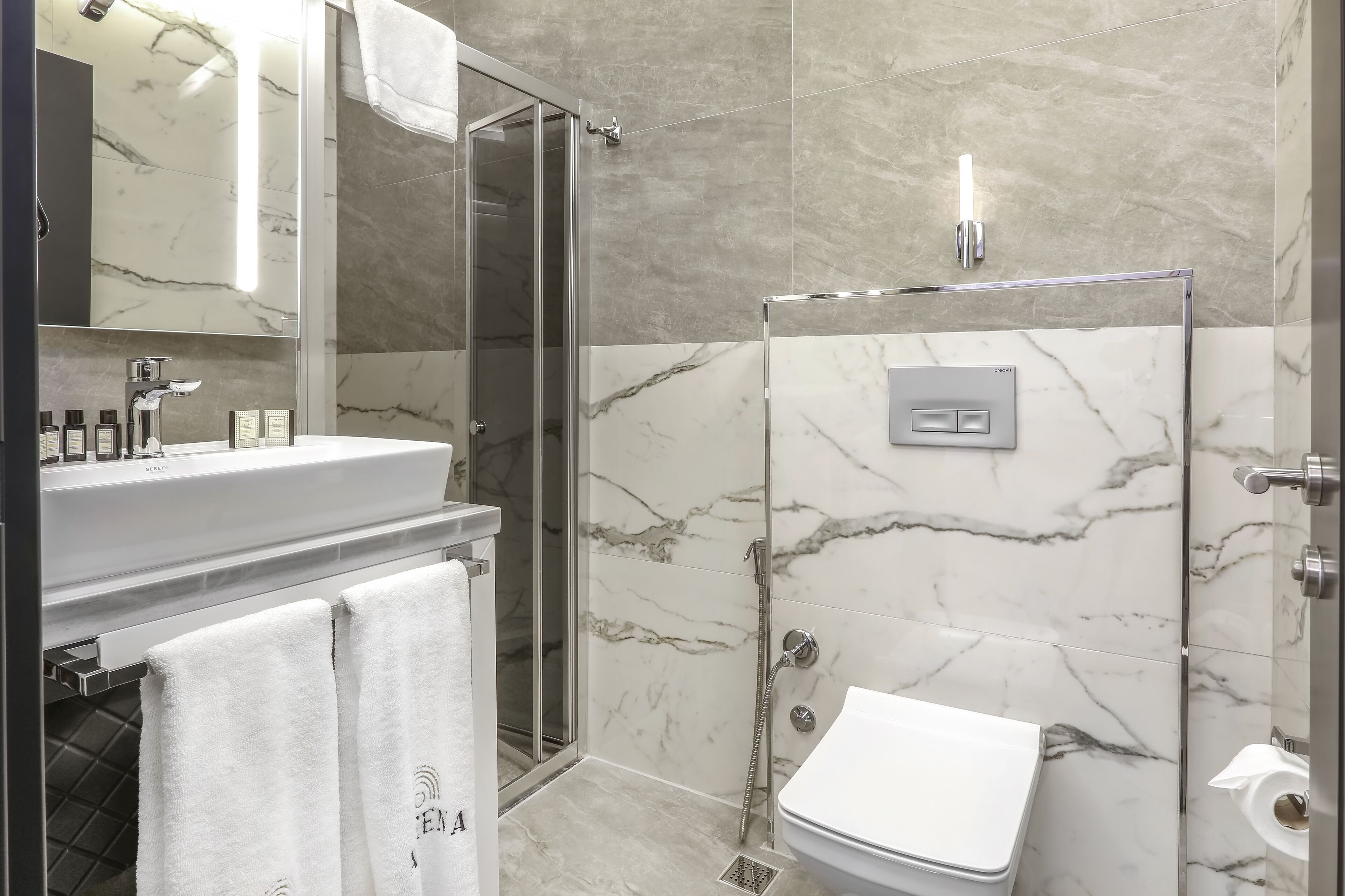 standard room | bathroom | shower, rainfall showerhead, hair dryer, bathrobes